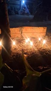 a group of lights sitting on a table at night at Hommestay Người Nùng in Hoàng Su Phì