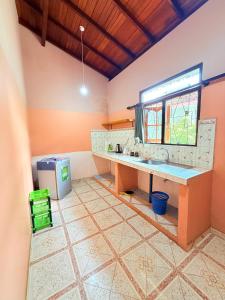 a kitchen with a sink in a room at Utopia Hikka in Hikkaduwa +54 photos