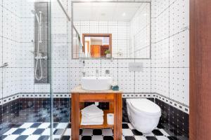 a bathroom with a sink and a toilet at Hotel Piast Wrocław Centrum in Wrocław +67 photos