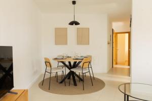 a dining room with a table and chairs at BV 01 Apartment in Amadora +26 photos
