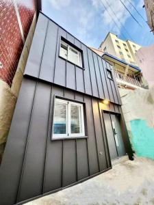 a house with two windows on the side of it at Beaver Stay, Bosu in Busan +70 photos