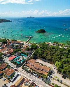 an aerial view of a beach with boats in the water at Suri Búzios Hotel in Búzios +38 photos