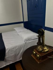 Ένα ή περισσότερα κρεβάτια σε δωμάτιο στο Hostel Palacio Bolonha