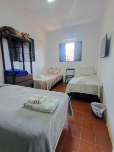 a room with two bunk beds and a tile floor at New hotel in Alegrete +43 photos