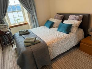 Katil atau katil-katil dalam bilik di Lochfyne-View Apartment
