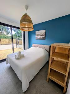 Ένα ή περισσότερα κρεβάτια σε δωμάτιο στο La Maison du Grand Large