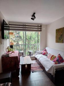 Giường trong phòng chung tại Depto cerca playa