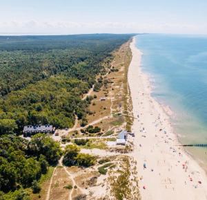an aerial view of a beach with people on it at Sea house Preila in Neringa
