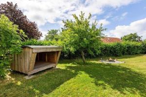 a wooden outhouse in the grass in a yard at SB116-Sydals-Birkemose-29 in Skovbyballe +13 photos