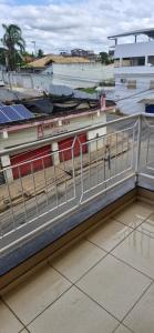 a balcony with a fence on top of a building at Casa da Jussara in Itaperuna