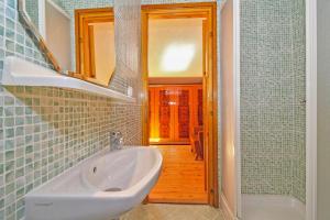 a bathroom with a sink and a mirror at Erika in Šumber (Haus für 4-6 Personen) in Nedeščina