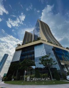 a large building with a lot of windows at Hive Stayz - 1 Bedroom in Catamaran Tower in Sanābis +32 photos