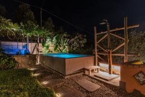 a swimming pool in a backyard at night at Villa Caruso with Private Pool in Sorrento