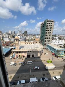 a view of a city with a parking lot and buildings at Grand Mombasa Apartments in Mombasa
