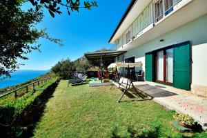 a house with a view of the ocean at Selak in Tučepi - Haus für 6-7 Personen in Tučepi