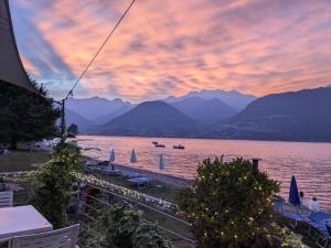 a view of a body of water with mountains at Bungalow Adria Lido di Colico , Direct on Lake & Central Town in Colico