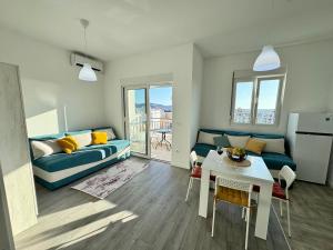 a living room with a couch and a table at Apartment LULU in Bar