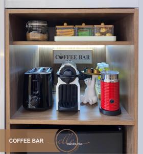 a coffee bar with a coffee maker on a shelf at Modern Unit at Shore 2 Mall of Asia by Elle Suite in Manila