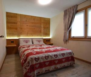 Ένα ή περισσότερα κρεβάτια σε δωμάτιο στο Appartamento Alice