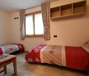 Ένα ή περισσότερα κρεβάτια σε δωμάτιο στο Appartamento Alice