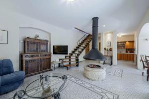 a living room with a fireplace and a staircase at Villa Ene in Pula - Haus für 6 Personen in Pula