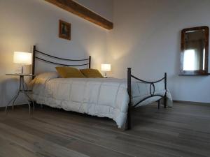 Ένα ή περισσότερα κρεβάτια σε δωμάτιο στο Pitaciò Affittacamere