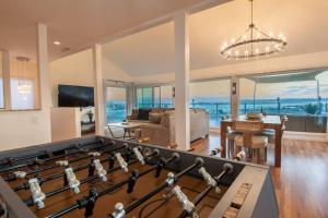 a living room with a large pool table at Luxury Hilltop Retreat in the City - Amazing View in San Diego