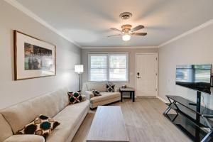 a living room with a couch and a ceiling fan at Hike and Explore Cheraw Apt 7 Mi to Lake Juniper! in Cheraw