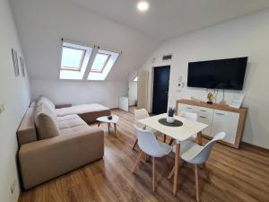 a living room with a couch and a table at Esther Line Apartments-Near Iulius Mall, Self Check-in,Free Private Parking subject to availability in Timişoara