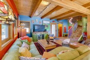 a living room with a couch and a tv at Casa de Nieve The Snowhouse in Steamboat Springs in Steamboat II