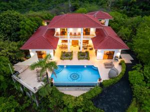 an aerial view of a house with a swimming pool at Villa Allamanda 5br Sunset View Villa Ocotal in Ocotal