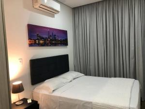 Ένα ή περισσότερα κρεβάτια σε δωμάτιο στο Flat com excelente localização na Granja Viana +21 φωτογραφίες