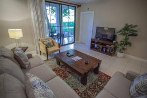 a living room with a couch and a coffee table at Casa Sommer 3br Resort Condo Pacifico L605 in Coco