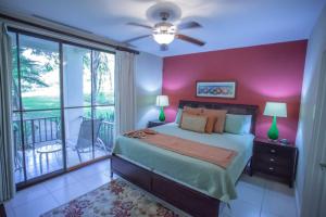 a bedroom with a bed and a balcony at Casa Sommer 3br Resort Condo Pacifico L605 in Coco