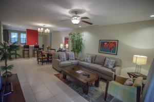 a living room with a couch and a table at Casa Sommer 3br Resort Condo Pacifico L605 in Coco