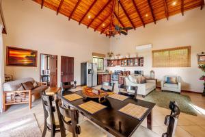 a living room with a table and chairs at Casa Lasky in Playa Hermosa