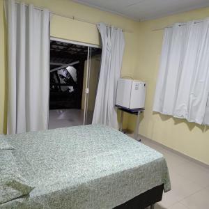 Ένα ή περισσότερα κρεβάτια σε δωμάτιο στο Suites João e Maria Quarto 05 +7 φωτογραφίες