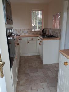 Kuchyň nebo kuchyňský kout v ubytování Garden Cottage