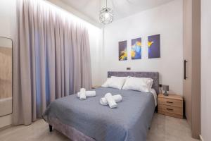 Postel nebo postele na pokoji v ubytování Corner Apartment