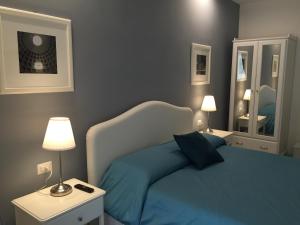 A bed or beds in a room at Rome Together Guest House