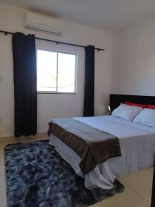 Ένα ή περισσότερα κρεβάτια σε δωμάτιο στο Apartamento para até 4 pessoas em Montes Claros