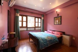 Una cama o camas en una habitación de Rehn Homestay