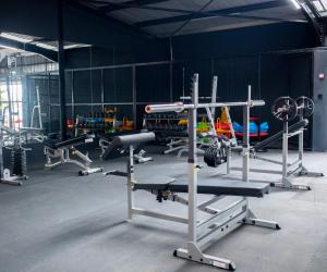 a gym with a lot of equipment in a room at Capitalcribs in Tatu City