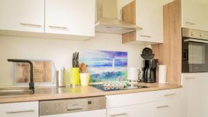 Η κουζίνα ή μικρή κουζίνα στο Apartment Pusteblume +6 φωτογραφίες