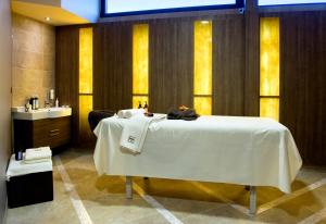 A bed or beds in a room at Hotel Turiec