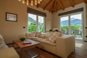 a living room with a couch and a table at Villa Ilaria in Lagundo