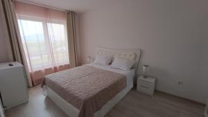 Ένα ή περισσότερα κρεβάτια σε δωμάτιο στο Stay Point Apartment