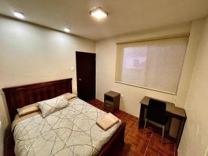 Postel nebo postele na pokoji v ubytování Apartamento en Loja