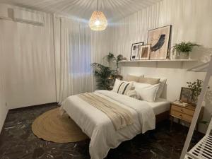 a bedroom with a bed and a potted plant at Posada Salviati in Vicenza