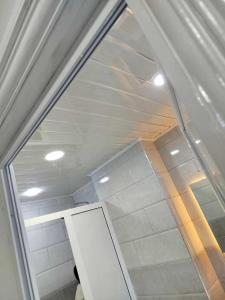a glass window in a room with a ceiling at Apartment f2, 58 m situé a kaktakit Boumerdes in Boumerdes